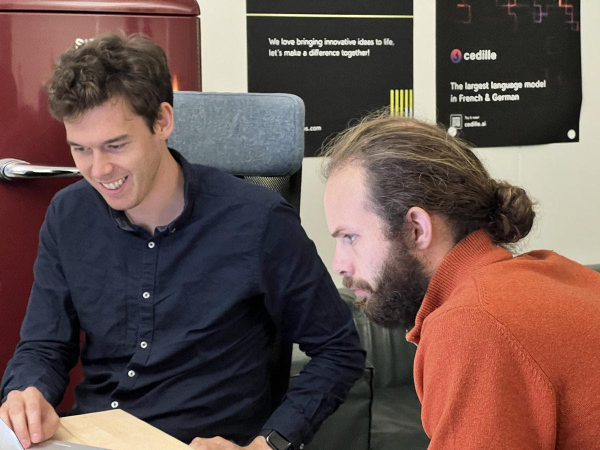 A picture containing text, person, indoorDescription automatically generated